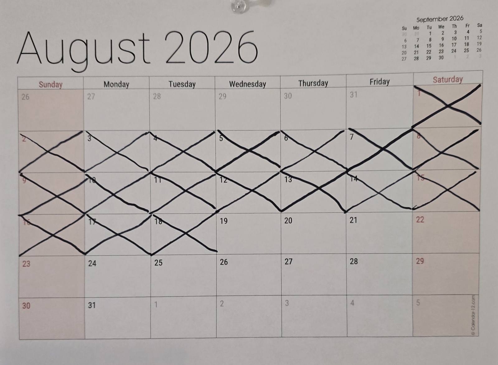The wall calendar with eighteen days crossed off