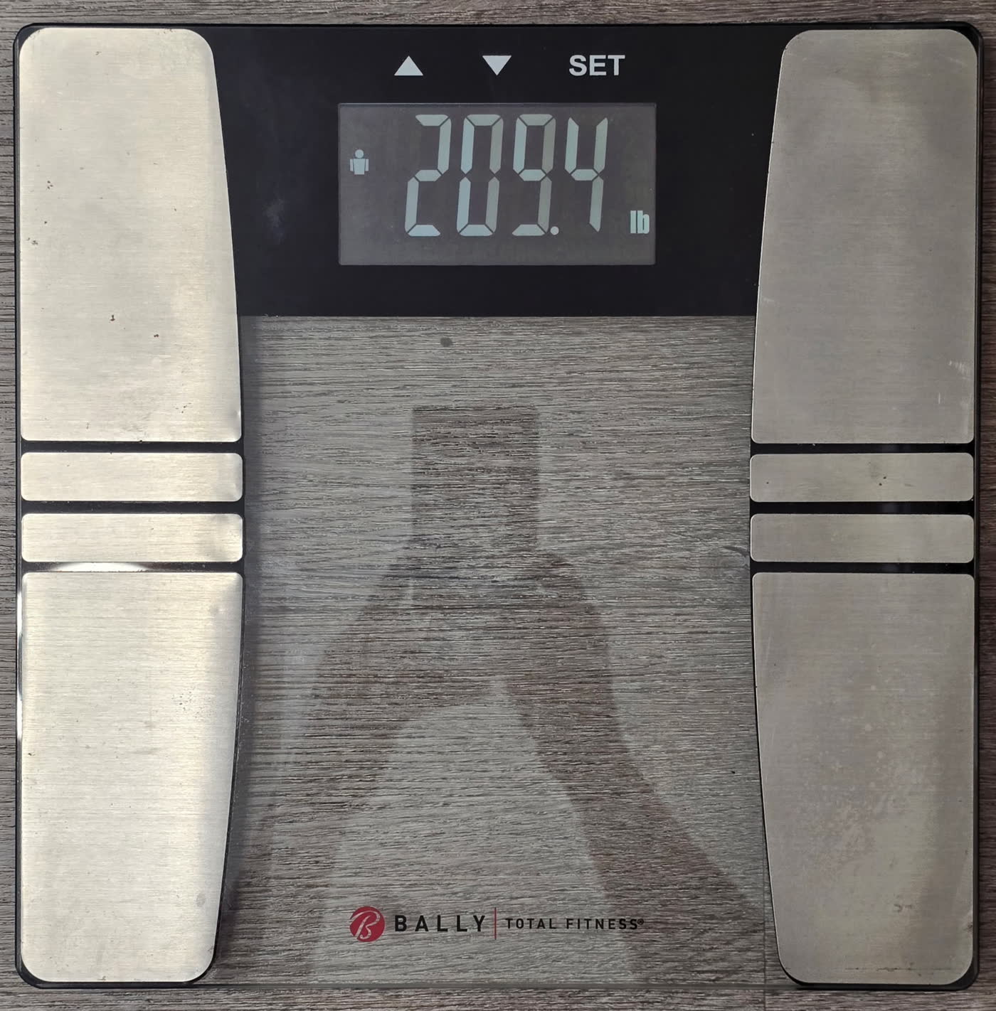 The scale on day 9 morning reading 209.4 pounds